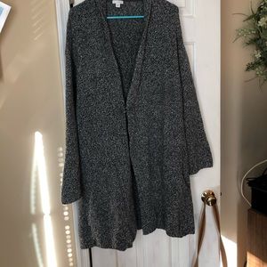 Sweater with pin closure .